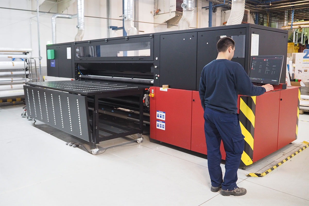 Press operator operating a large format Jeti Tauro digital printer