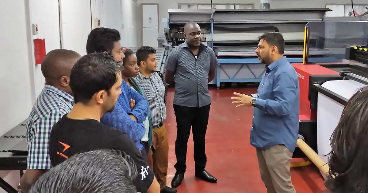Delfina Promotions Team Introducing the new printer to the team