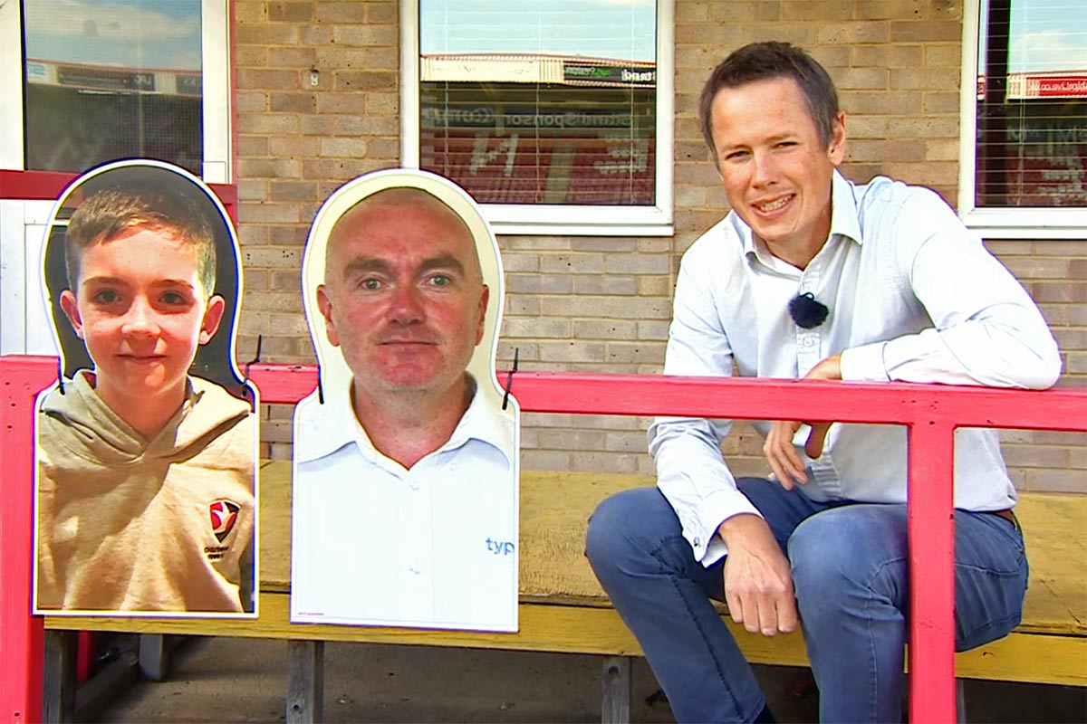 Two cutouts of football fans